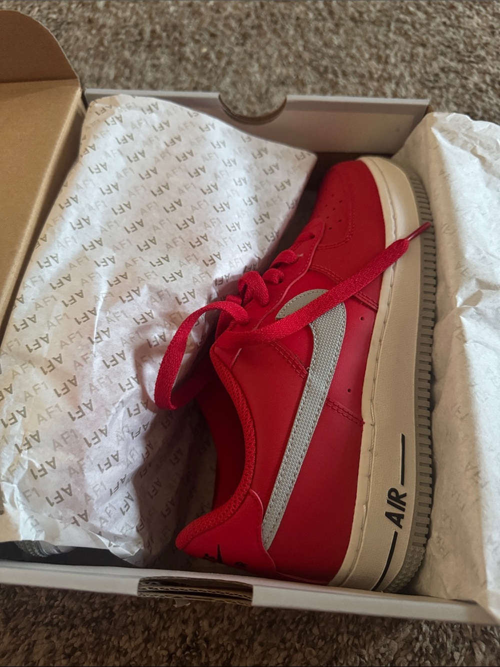 Nike Kids Red Low-Top Sneaker with Silver Swoosh and White Sole
